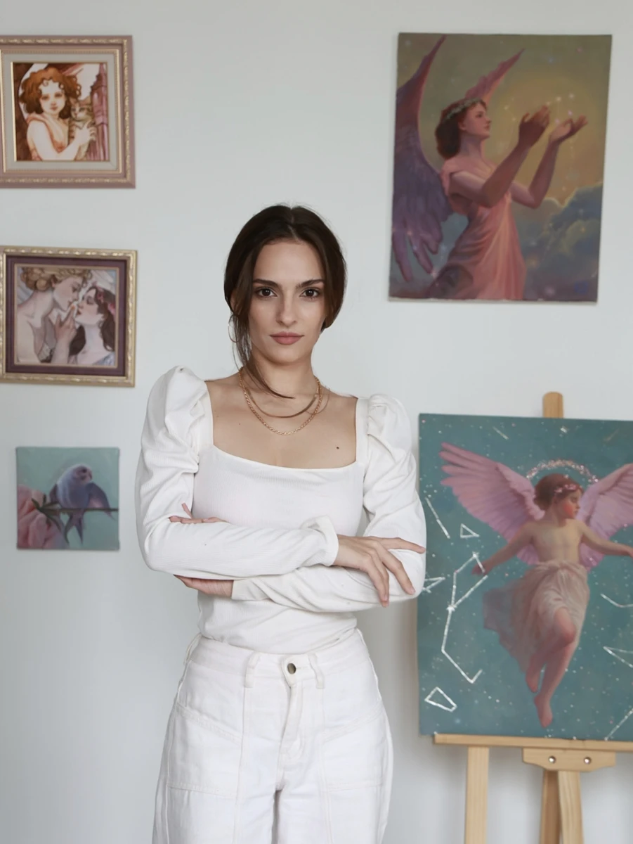 The artist in her studio with her paintings